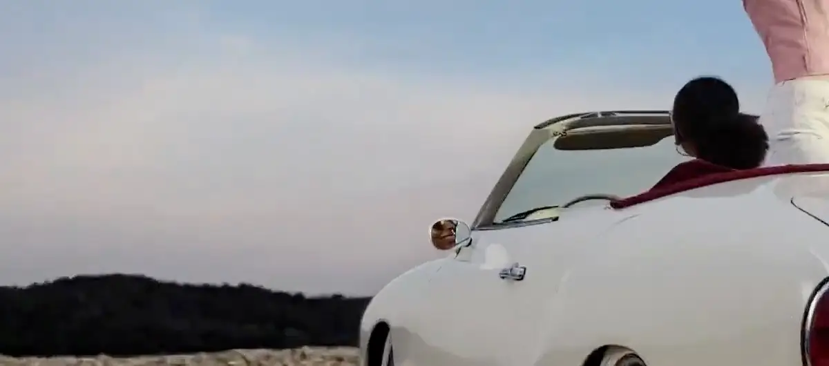 At 3x: the side of the car, a face just visible in its wing mirror