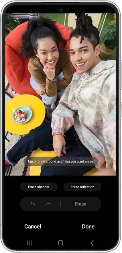 Object Eraser open on a photo of two friends on a beanbag, a plate of food beside them