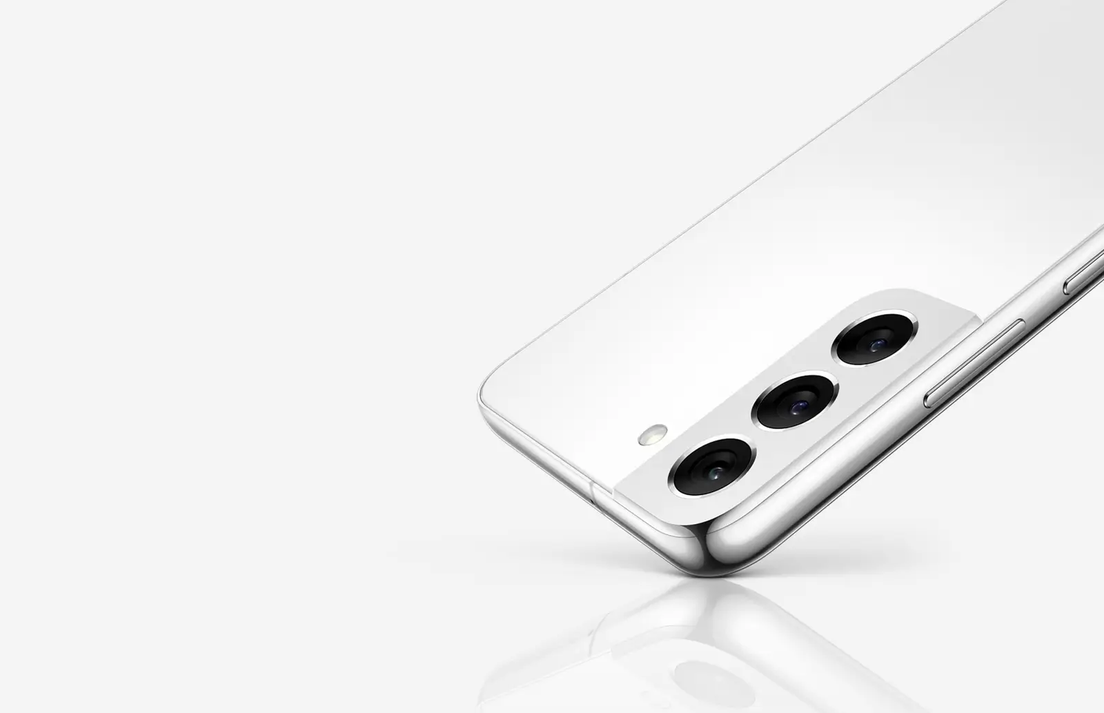 Galaxy S22+ in Phantom White from the back, balanced on one corner