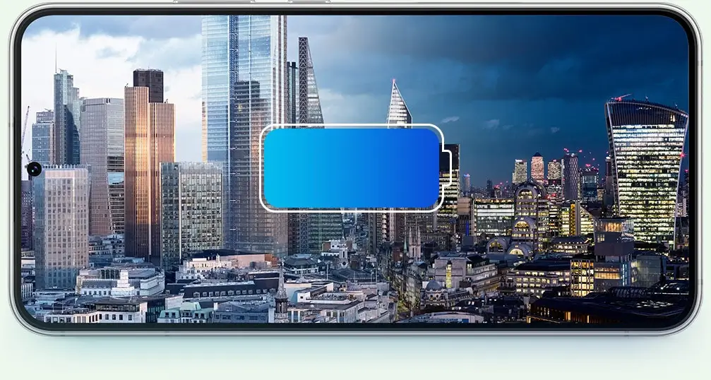 Galaxy S22+ held sideways, a city skyline turning from day to night behind a battery icon