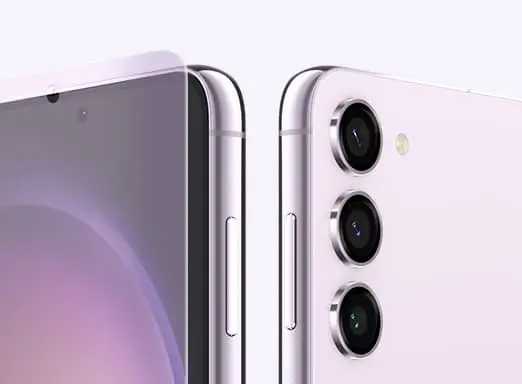 The edges of two Lavender Galaxy S23 phones, the screen of one and the three cameras of the other