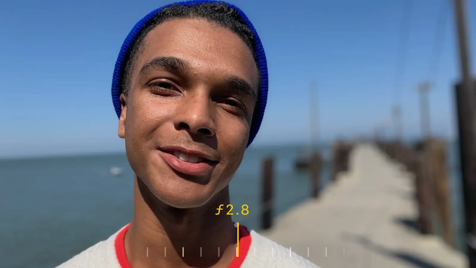 The same portrait with less blur, the pier's posts starting to show