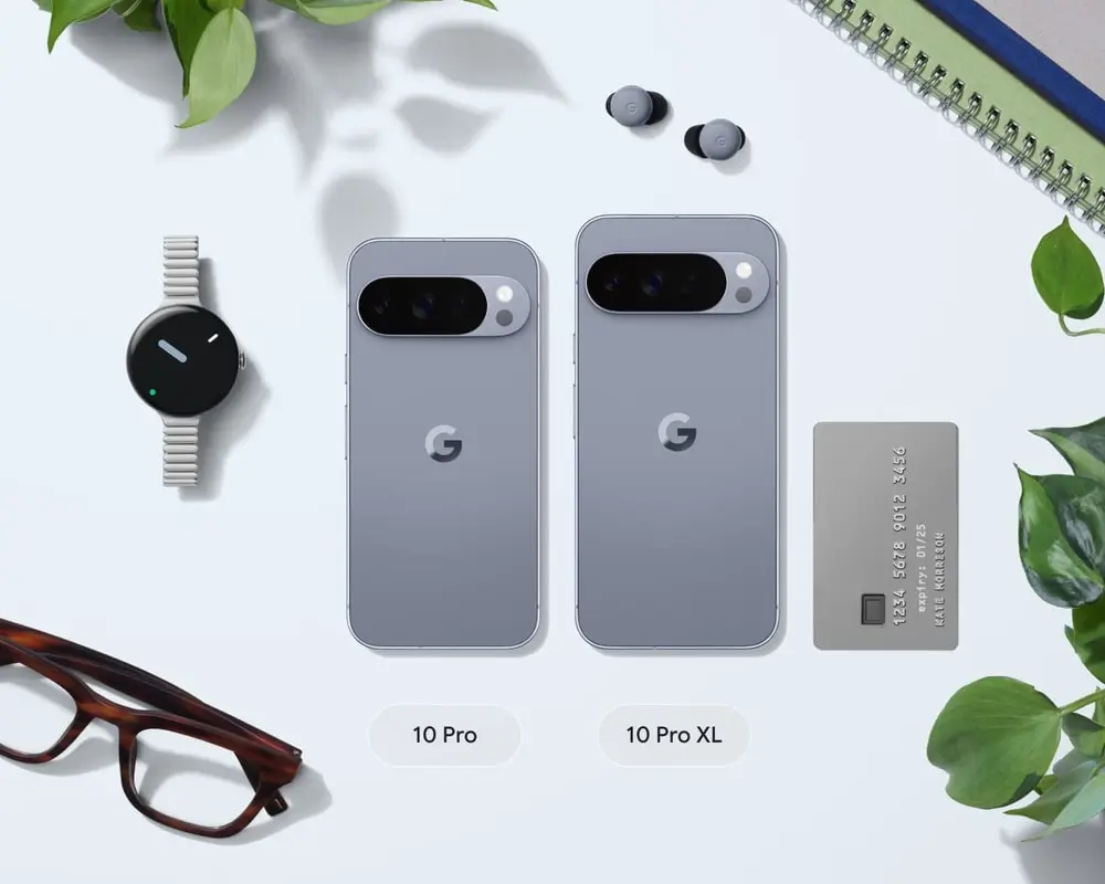 Pixel 10 Pro and Pro XL side by side among a Pixel Watch 4, Pixel Buds 2a, a bank card and a pair of glasses