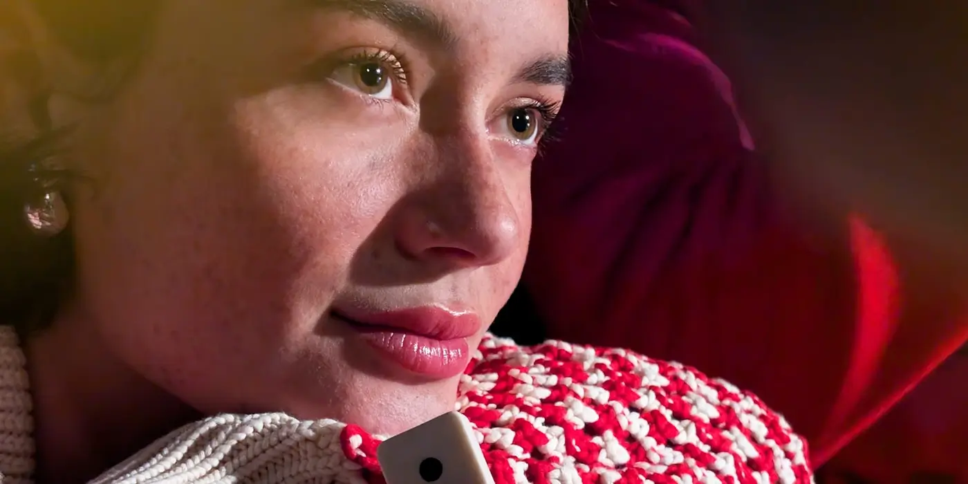 Telephoto: an angled portrait of a woman in a textured red-and-white sweater