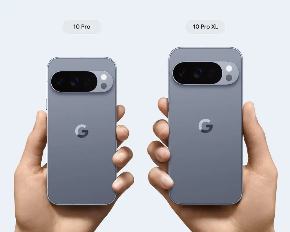 Two hands hold up a Pixel 10 Pro and a larger Pixel 10 Pro XL in Moonstone, labelled 10 Pro and 10 Pro XL