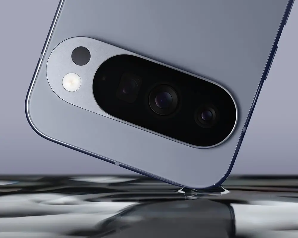 A Moonstone Pixel 10 Pro upside down, one corner touching a liquid surface