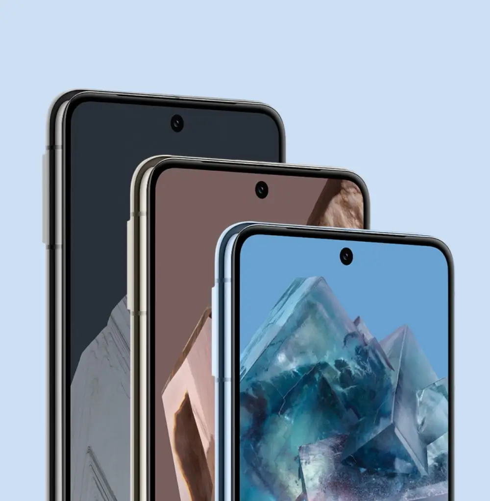 Pixel 8 Pro phones in Obsidian, Porcelain and Bay standing one behind another