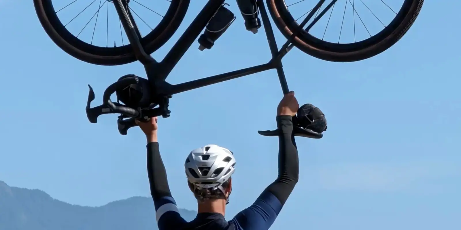 At 30x: the bike's frame, wheels and the cyclist's helmeted head close up